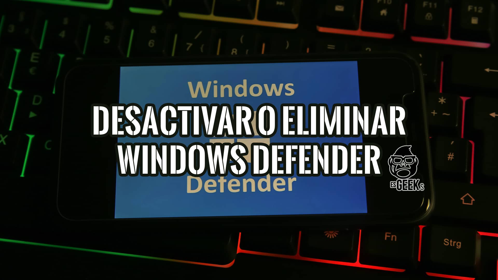 Cómo Desactivar o Eliminar Windows Defender en Windows 16 Un teléfono móvil muestra el texto "Desactivar o Eliminar Windows Defender" sobre un teclado iluminado.
