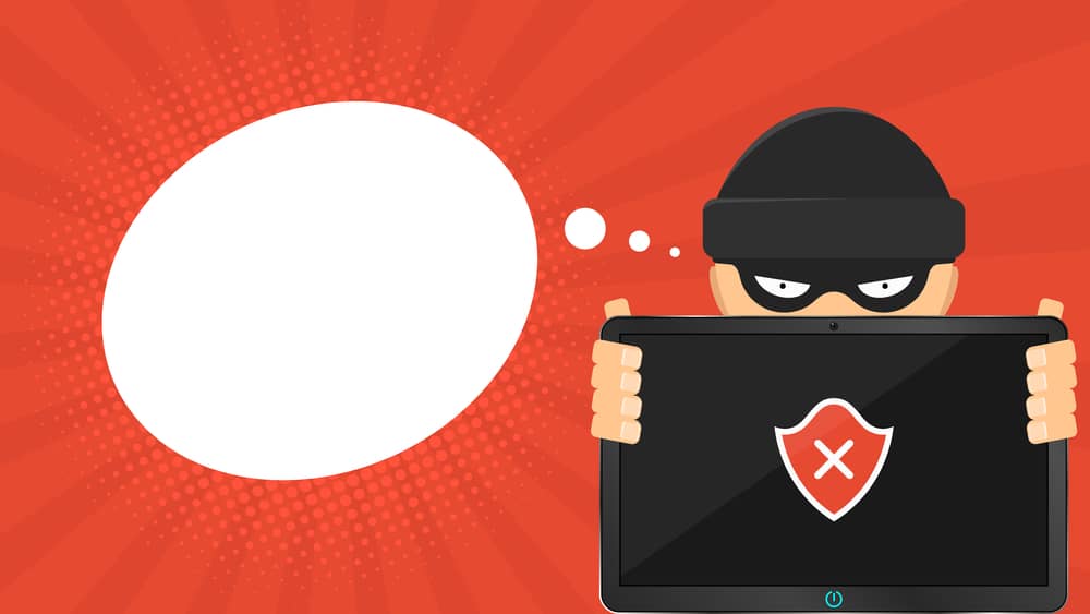 Falsos Positivos de Antivirus: Las Debilidades que Ocultan 17 Hacker de dibujos animados con un portátil mostrando un error de antivirus en un escudo rojo, con fondo rojo y bocadillo.