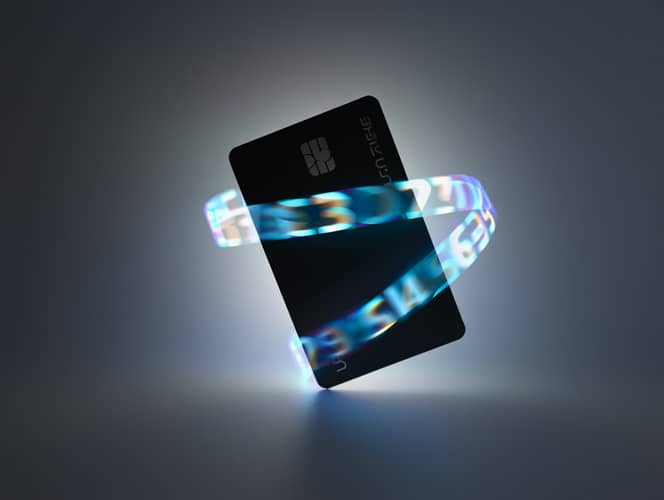 BIN Checker: todo lo que necesitas saber sobre la herramienta de verificación de tarjetas 17 Tarjeta de crédito negra rodeada por un halo de luz con números, representando la tecnología de un BIN checker para seguridad.